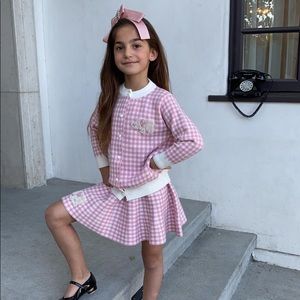 Pink and white two-piece suit